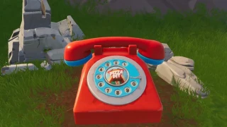 Fortnite : Défi semaine 8 : Composer le numéro de Pizza Pit sur le téléphone géant à l'est du Bloc