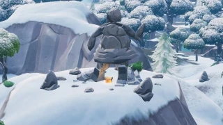 Fortnite : Défi semaine 8 : Chercher entre une trappe mystérieuse, une géante de pierre et un camion en situation précaire
