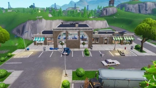 Fortnite : Défi semaine 4 Étape 5 : Visiter l'enseigne NOMS à Retail Row